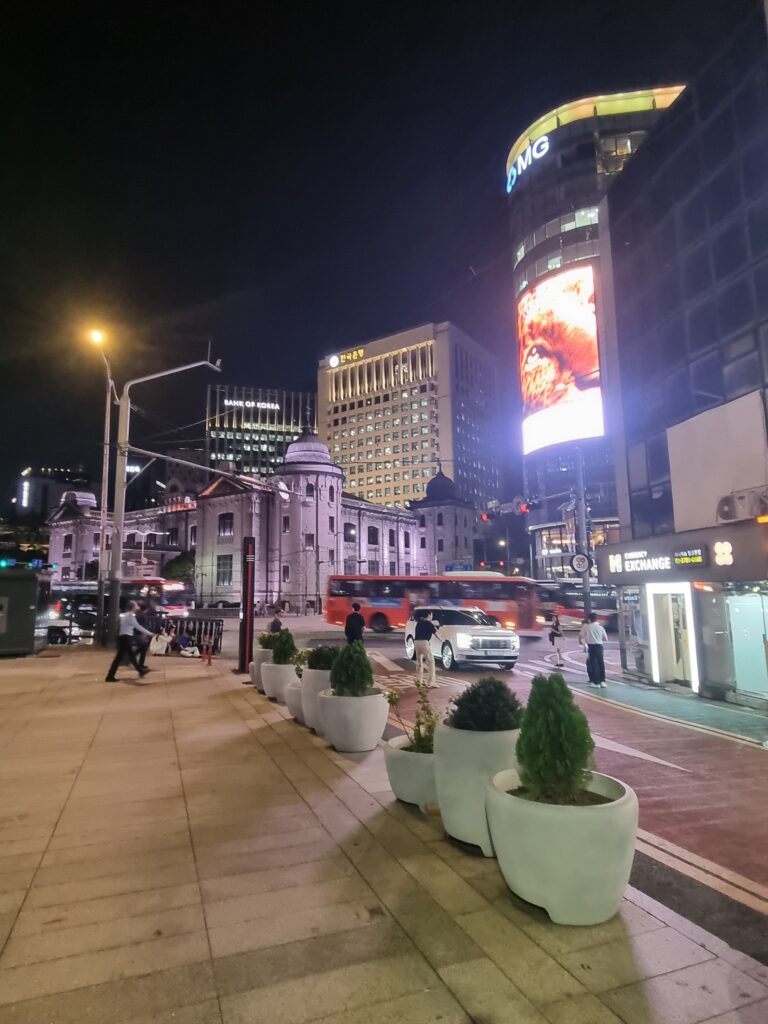 Myeongdong street at night with illuminated buildings and shops in Seoul