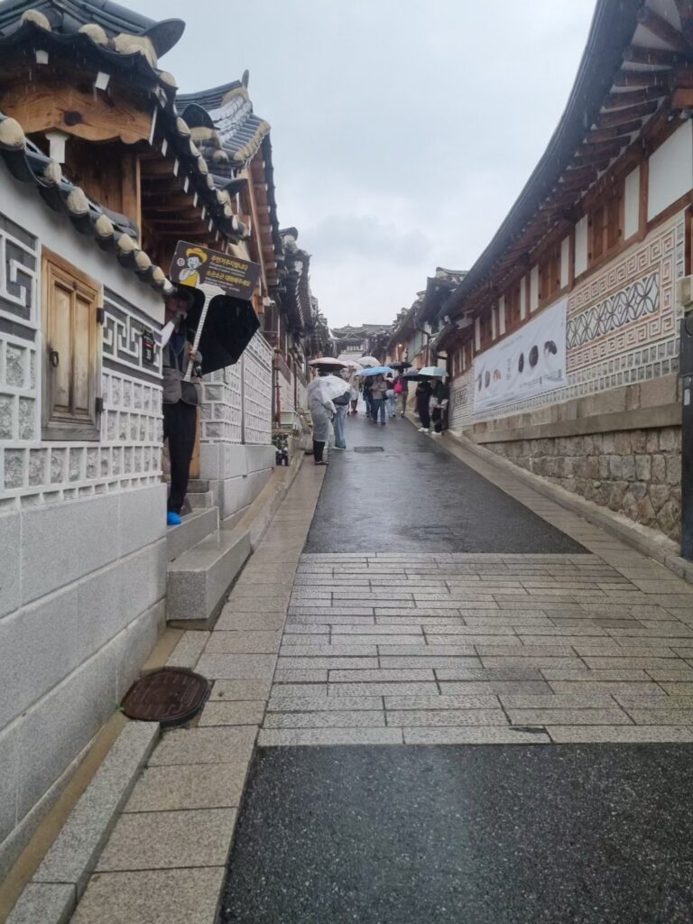 Narrow stone-paved street lined with traditional hanok houses in Bukchon Hanok Village