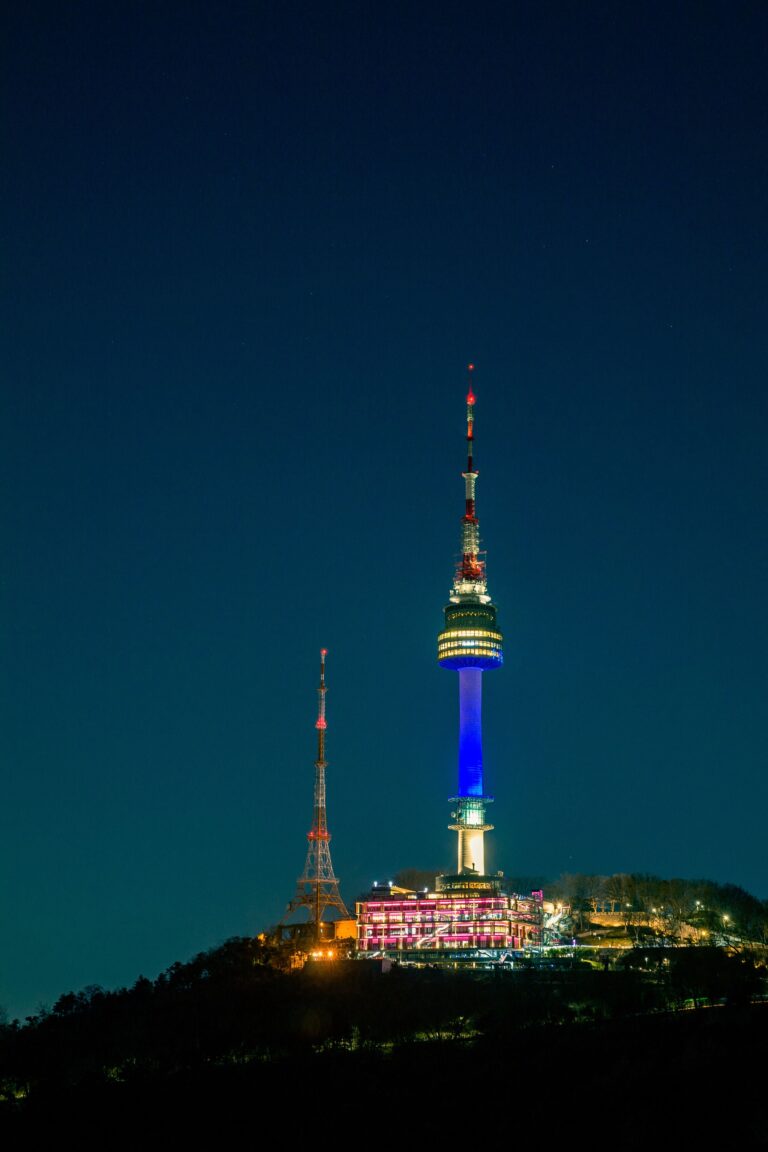 N Seoul Tower illuminated at night on Namsan Mountain in Seoul